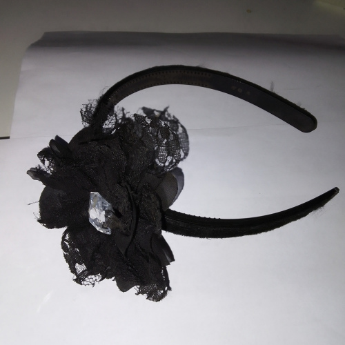 black flower detail with diamond in center aliceband
